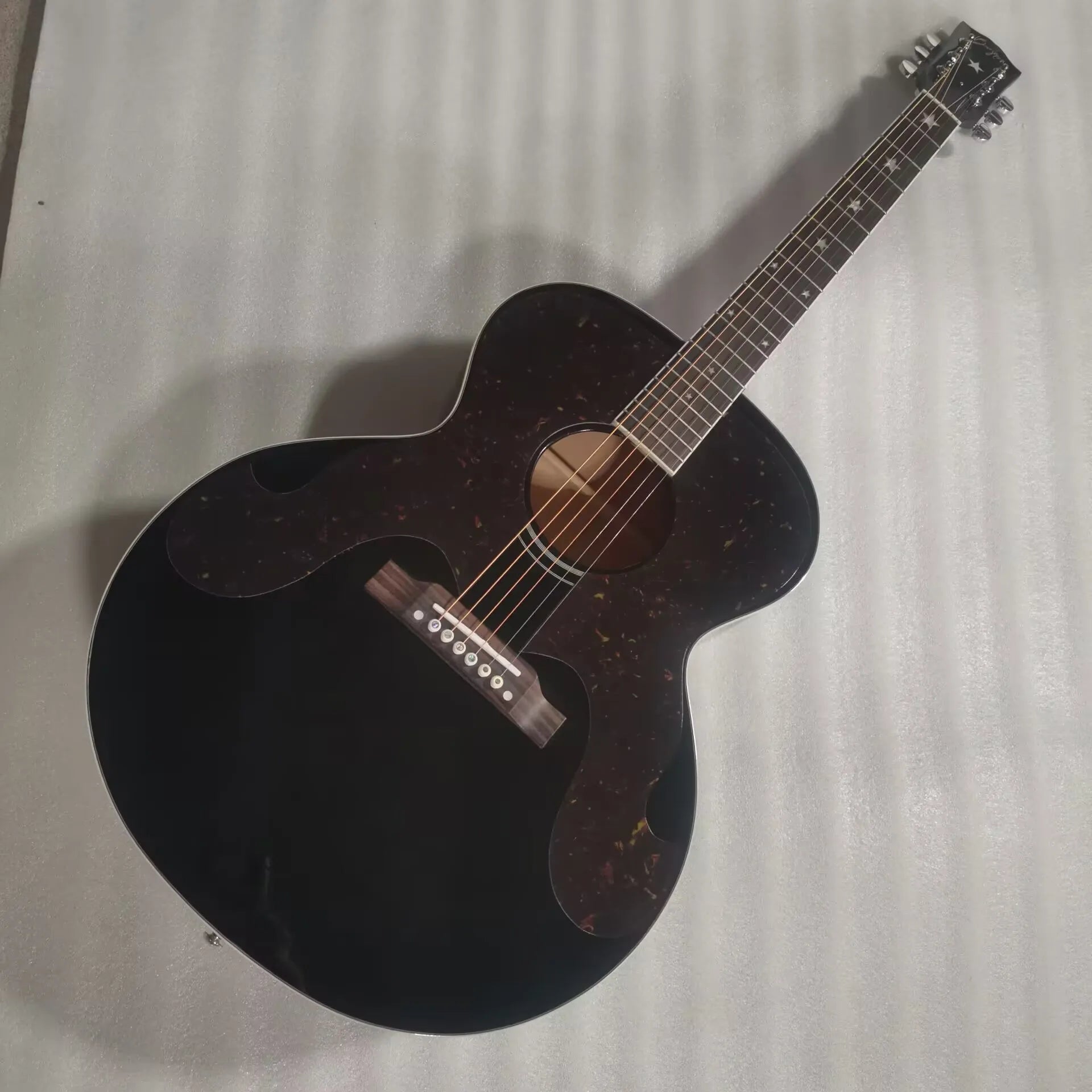 Black acoustic guitar, star inlay elvis brother style guitar